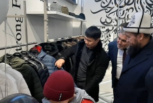 Глава ДУМК и депутат парламента на открытии бутика (фото)