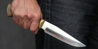В Токмаке мужчину избили и порезали ножом (фото +18)